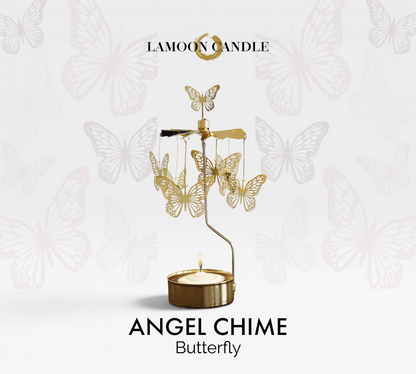Golden butterfly charms hanging on a spinning thermal carousel tealight candle holder