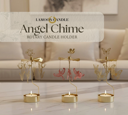 Gold angel chime rotary candle holder with decorative elements on a marble surface.