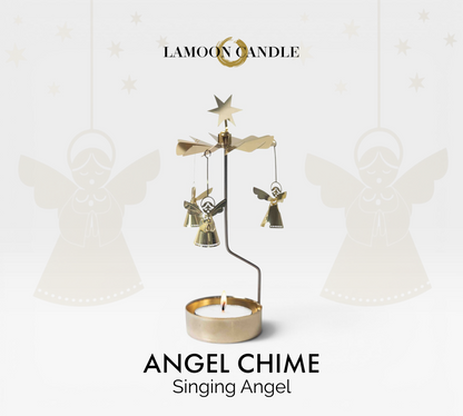 LaMoon Candle gold Singing Angel Chime rotary candle holder with lit tealight spinning on black background