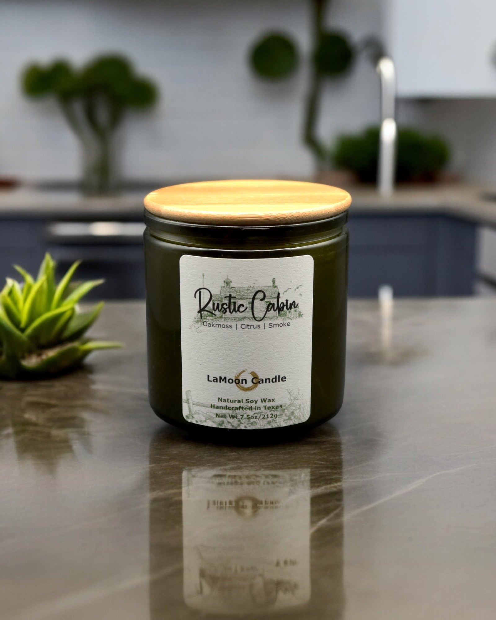 Natural soy wax candle in vintage green glass container and bamboo lid.