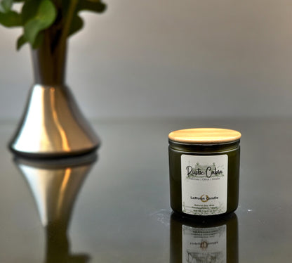 Natural soy wax candle in vintage green glass container and bamboo lid.