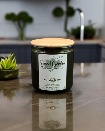 Natural soy wax candle in vintage green glass container and bamboo lid.