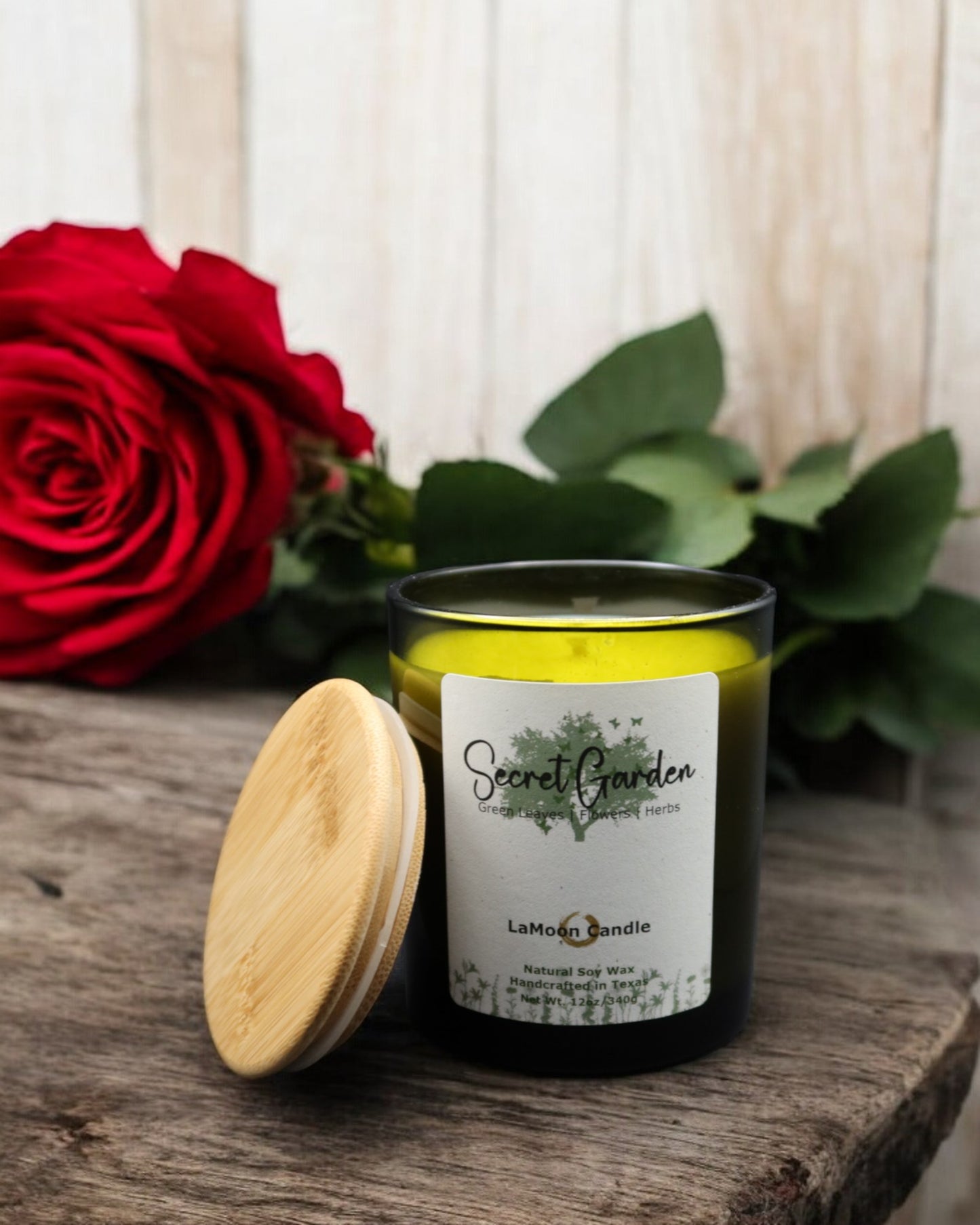 Natural soy wax candle in vintage green glass container and bamboo lid.
