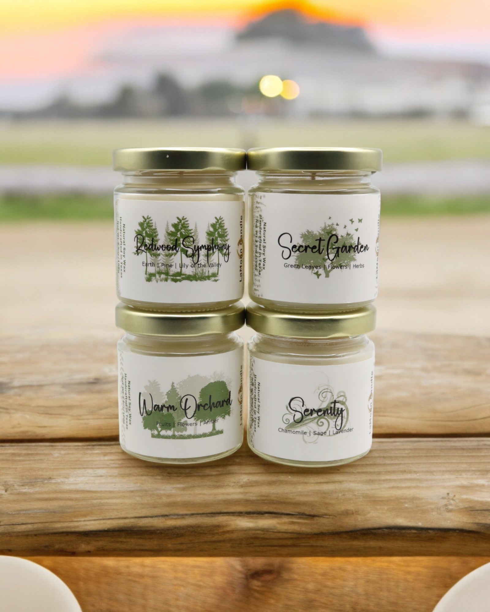 Natural soy wax candle in clear glass container and twist gold lid.