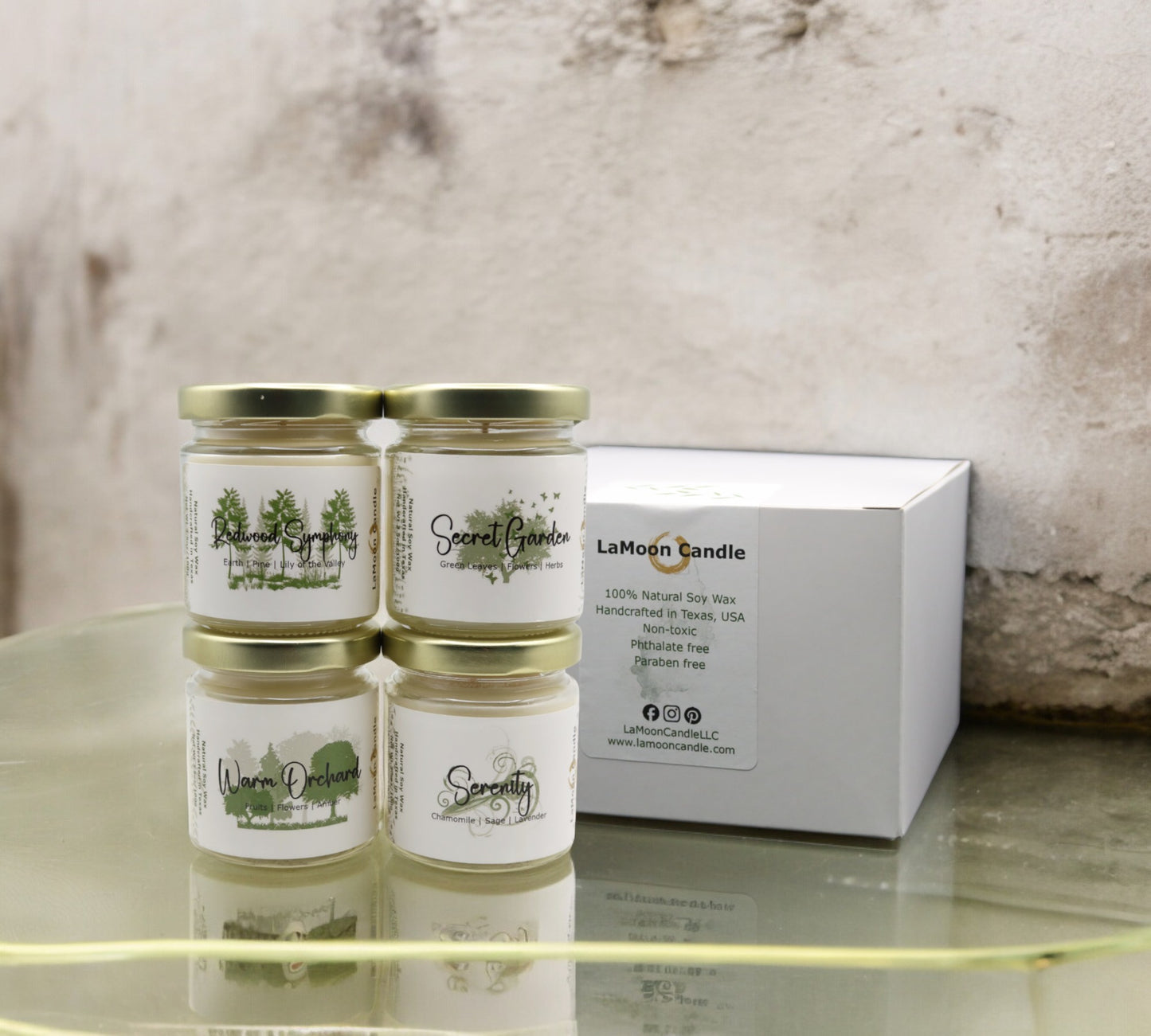 Natural soy wax candle in clear glass container and twist gold lid.