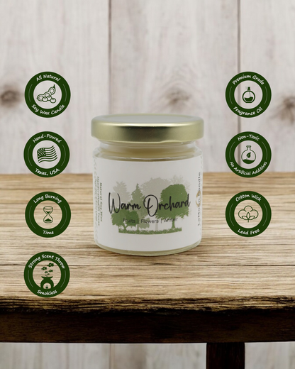 Natural soy wax candle in clear glass container and twist gold lid.