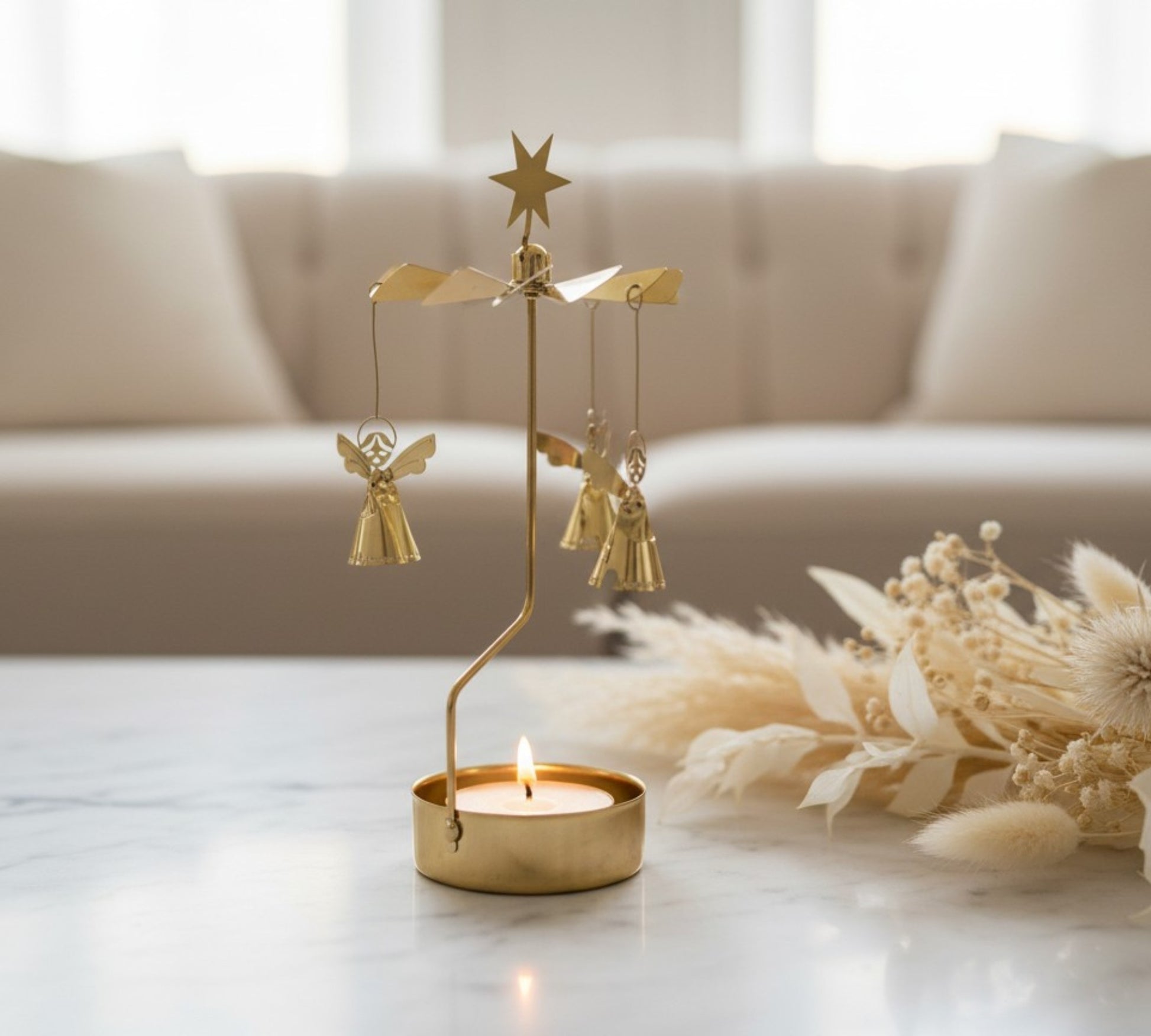 Spinning Angel Chime candle carousel on a table in the living room.